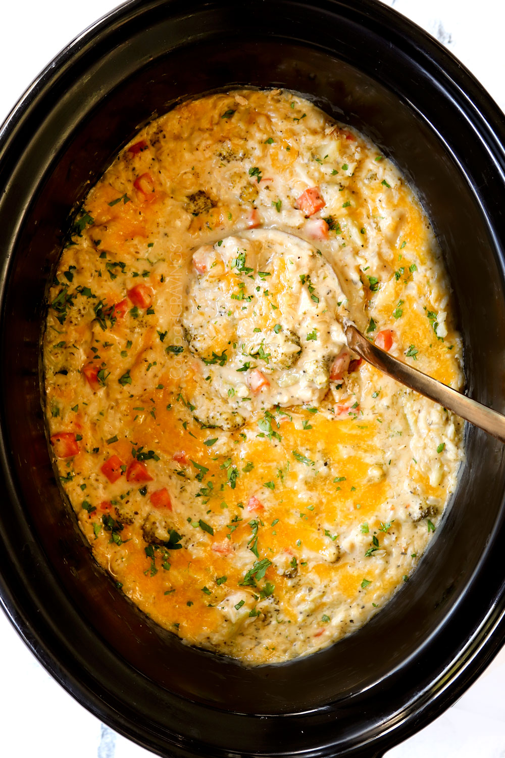 top view of chicken and rice with cheese in the crockpot