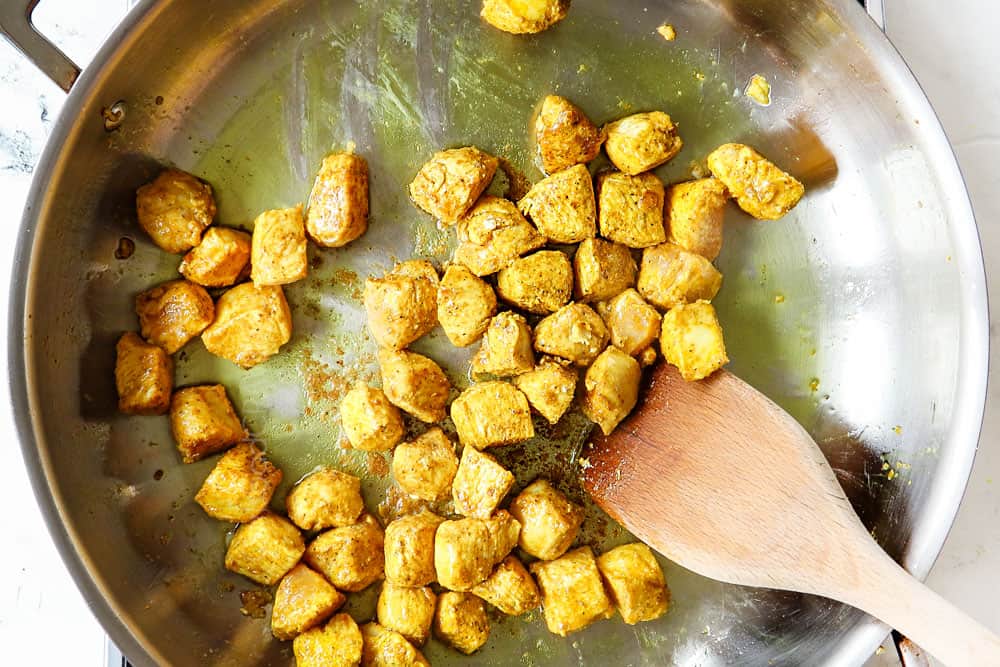 showing how to make peanut noodles recipe by cooking the chicken in a skillet