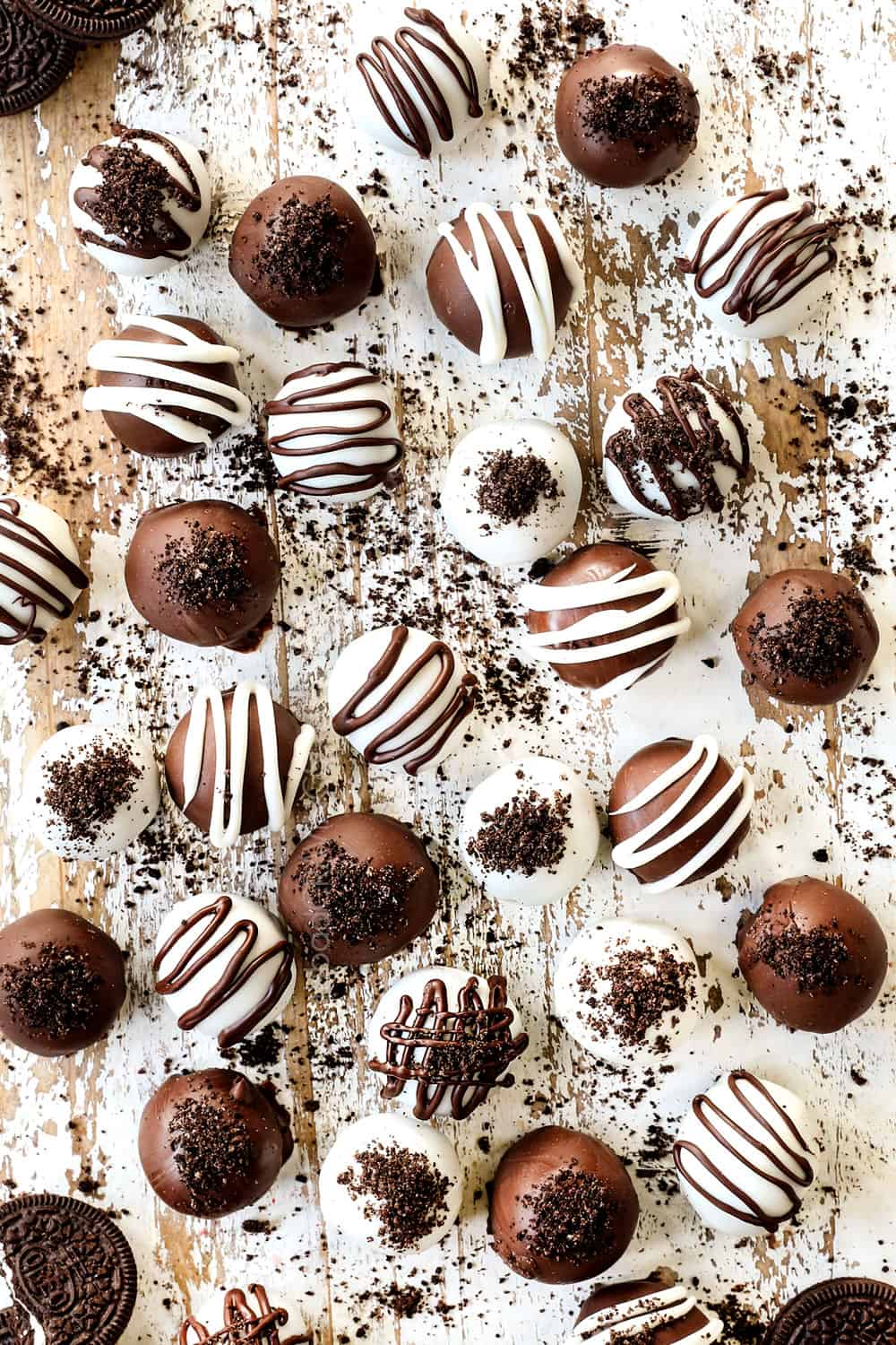 top view of oreo truffles drizzled with chocolate and topped with crushed oreos