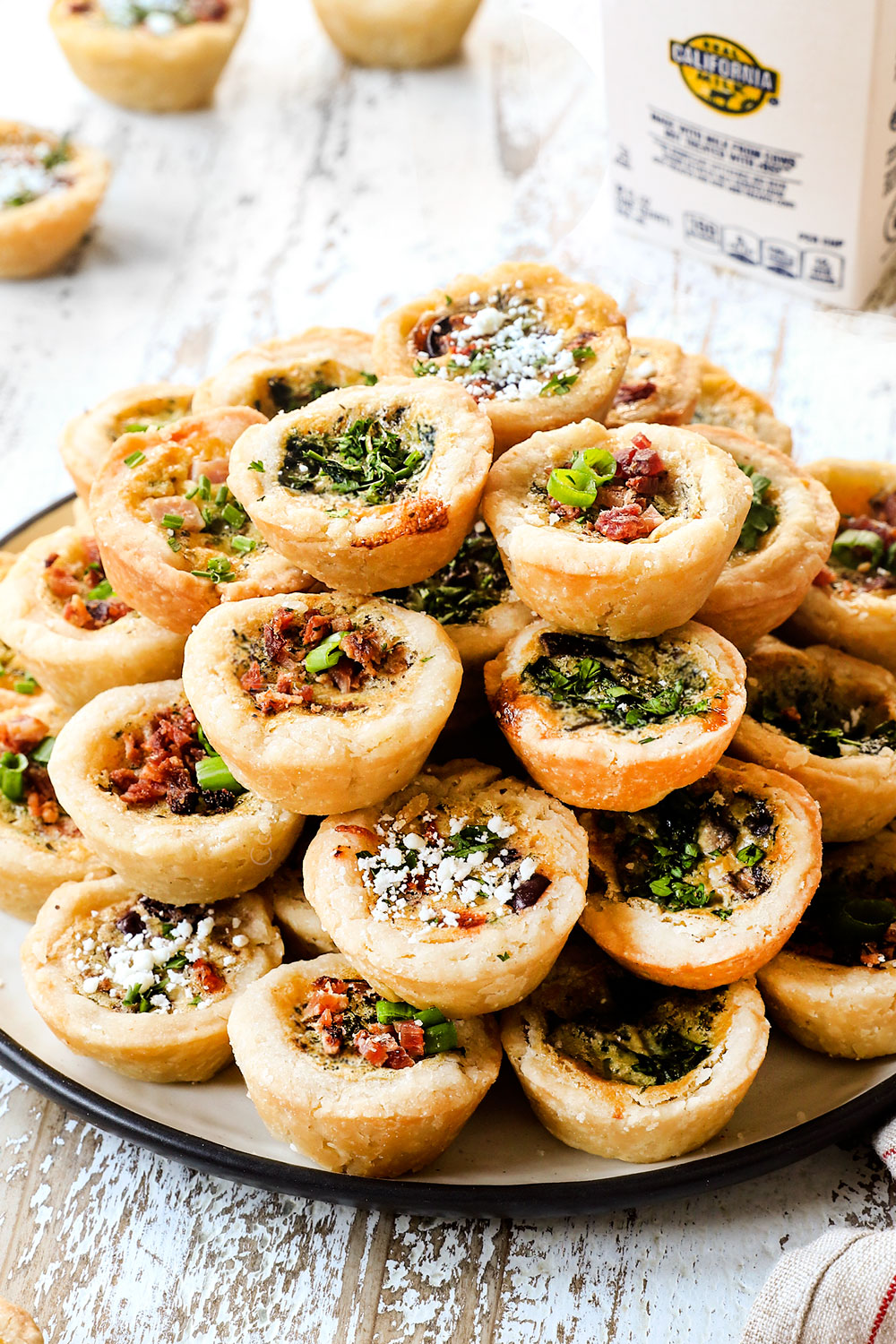 a stack of mini quiche recipe showing the different kinds of quiche