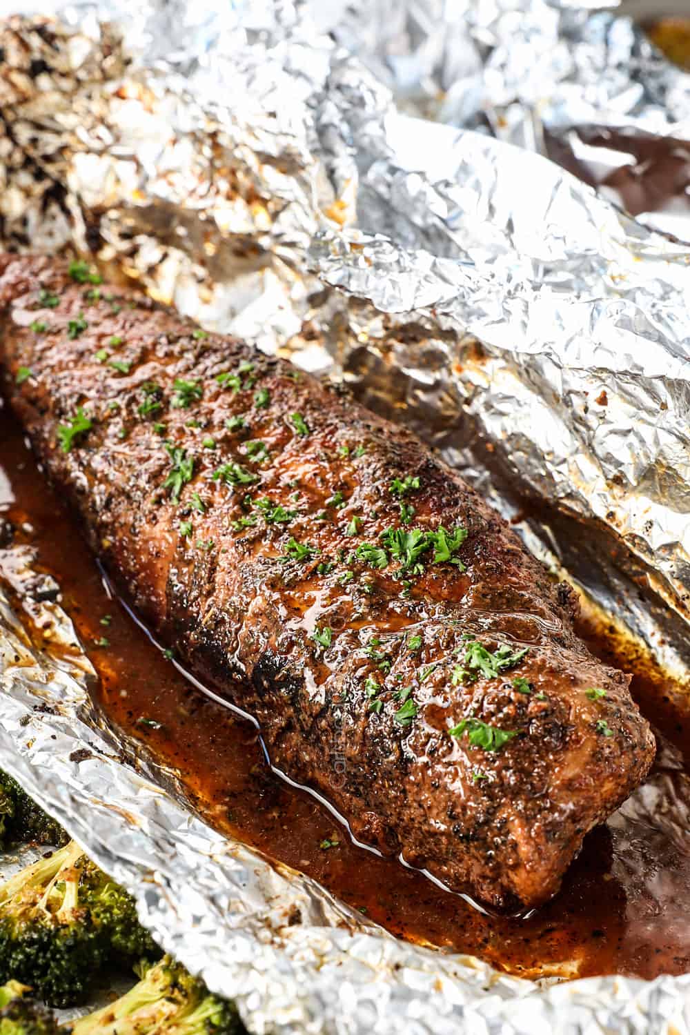 showing how to cook pork tenderloin by basting in balsamic sauce