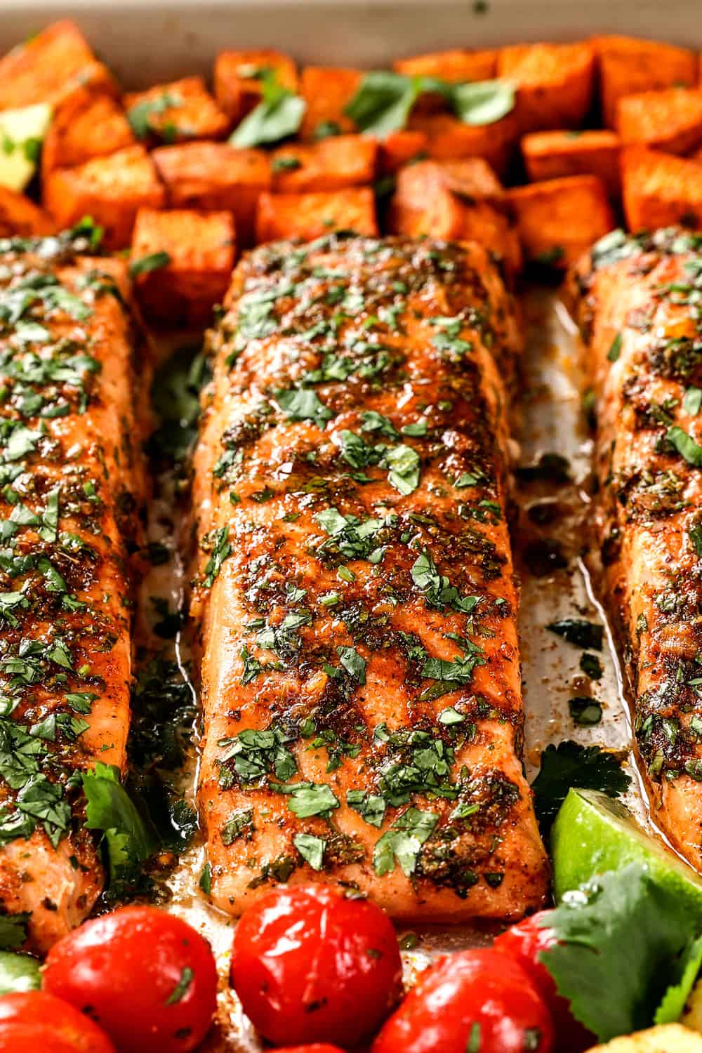 up close of baked cilantro salmon showing how juicy it is