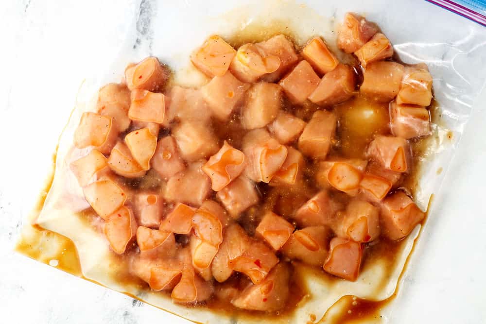 showing how to make chicken teriyaki stir fry recipe by marinating chicken in a plastic bag