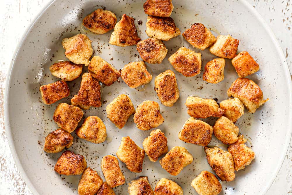 showing how to make apricot chicken recipe by cooking chicken in a nonstick skillet until crispy and golden