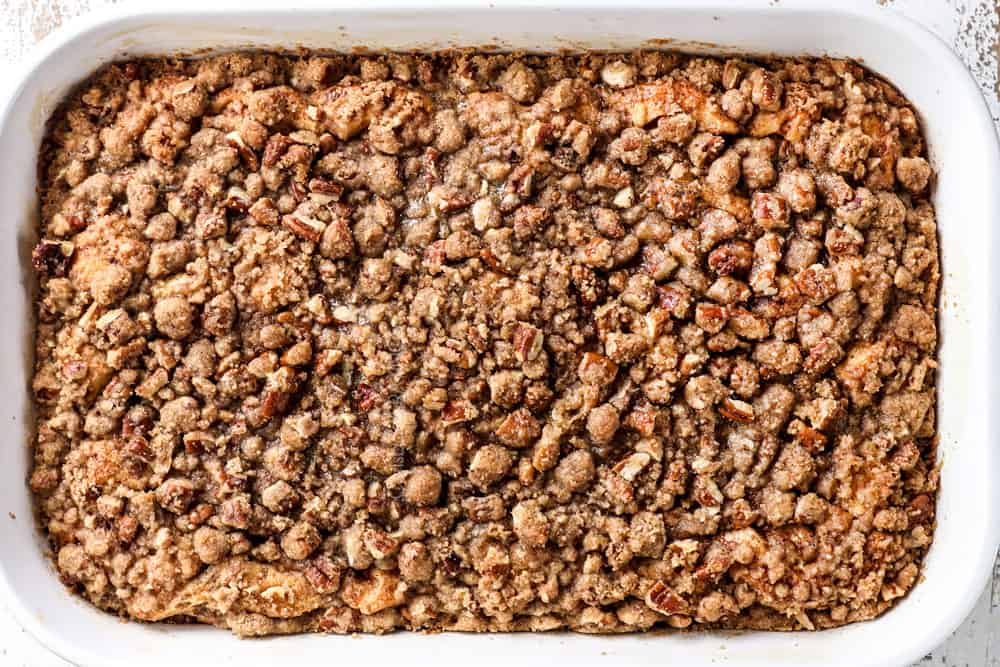 showing how to make cinnamon roll French toast casserole by baking until the top is golden ddin