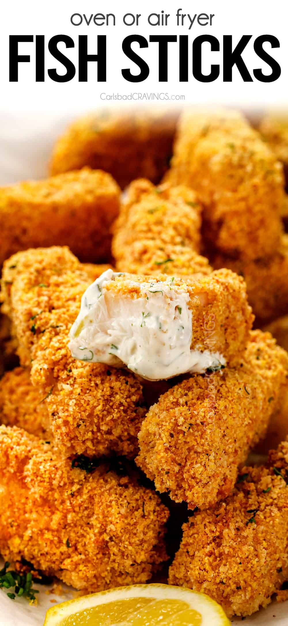 up close of fish sticks with a bite taken out showing how juicy it is