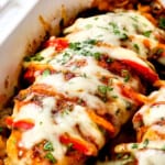 up close of a piece of Hasselback chicken topped with cheese