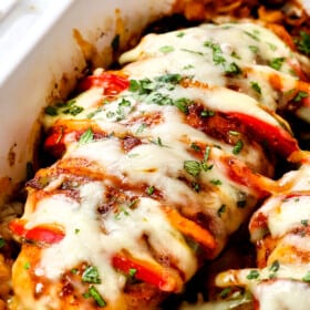 up close of a piece of Hasselback chicken topped with cheese