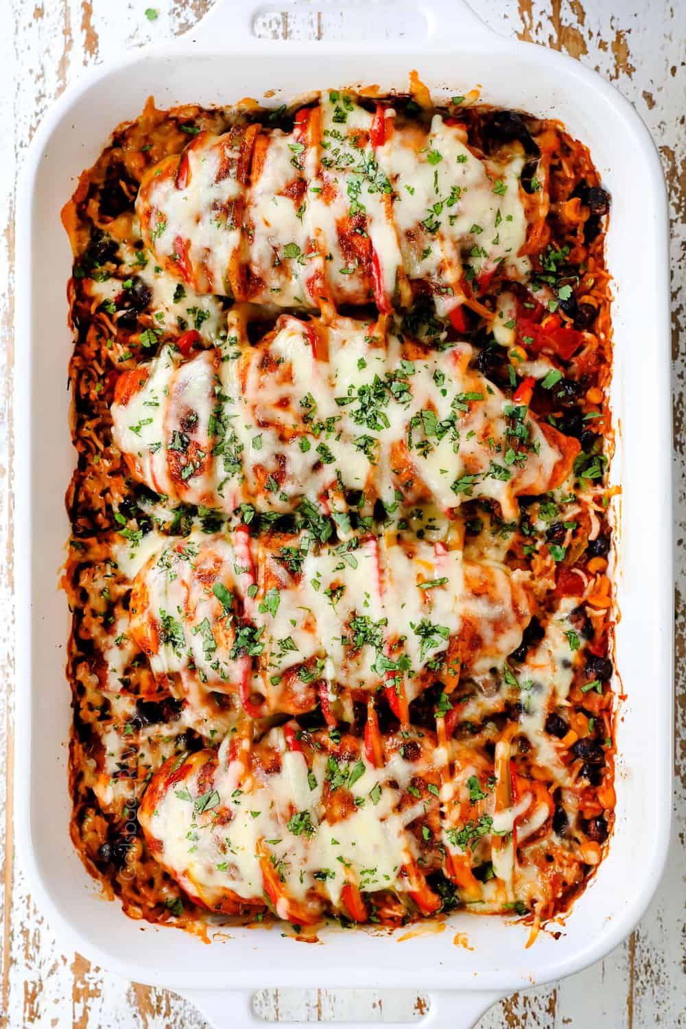 showing how to make Hasselback chicken by baking until the cheese is melted