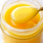 up close of lemon curd in a jar showing how creamy it is