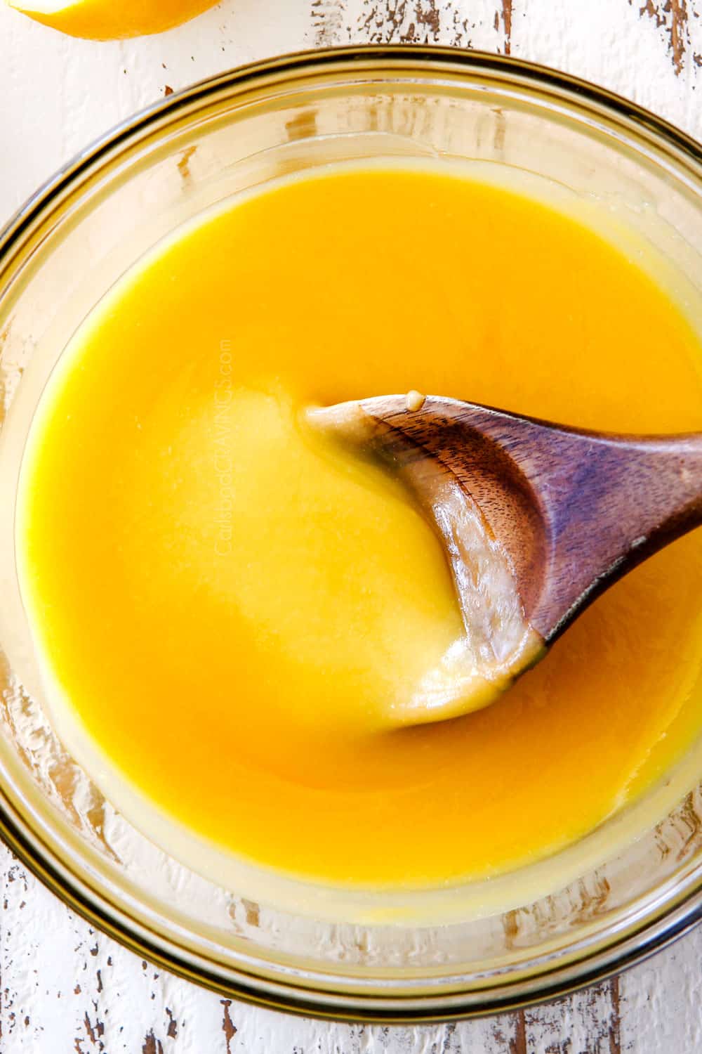 top view of lemon curd in a glass bowl showing how creamy it is