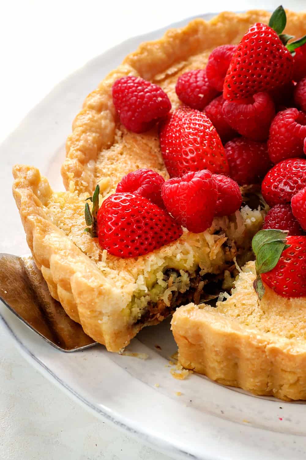 taking out a piece of coconut pie with a spatula