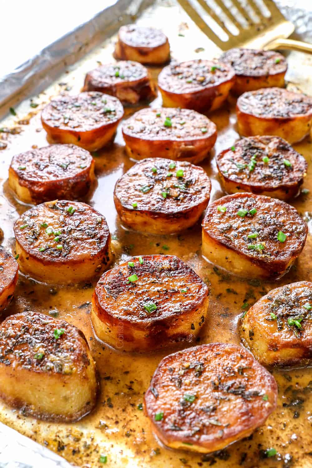 up close of melting potatoes recipe showing how caramelized the potatoes are