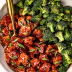 top view of sesame chicken recipe in a skillet with stir fried broccoli