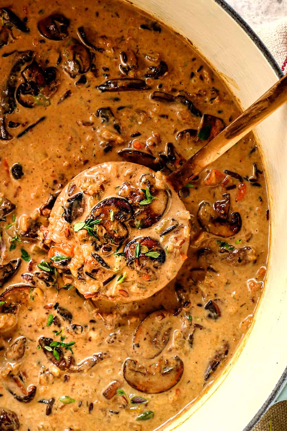 top view of creamy mushroom soup with wild rice in a soup pot