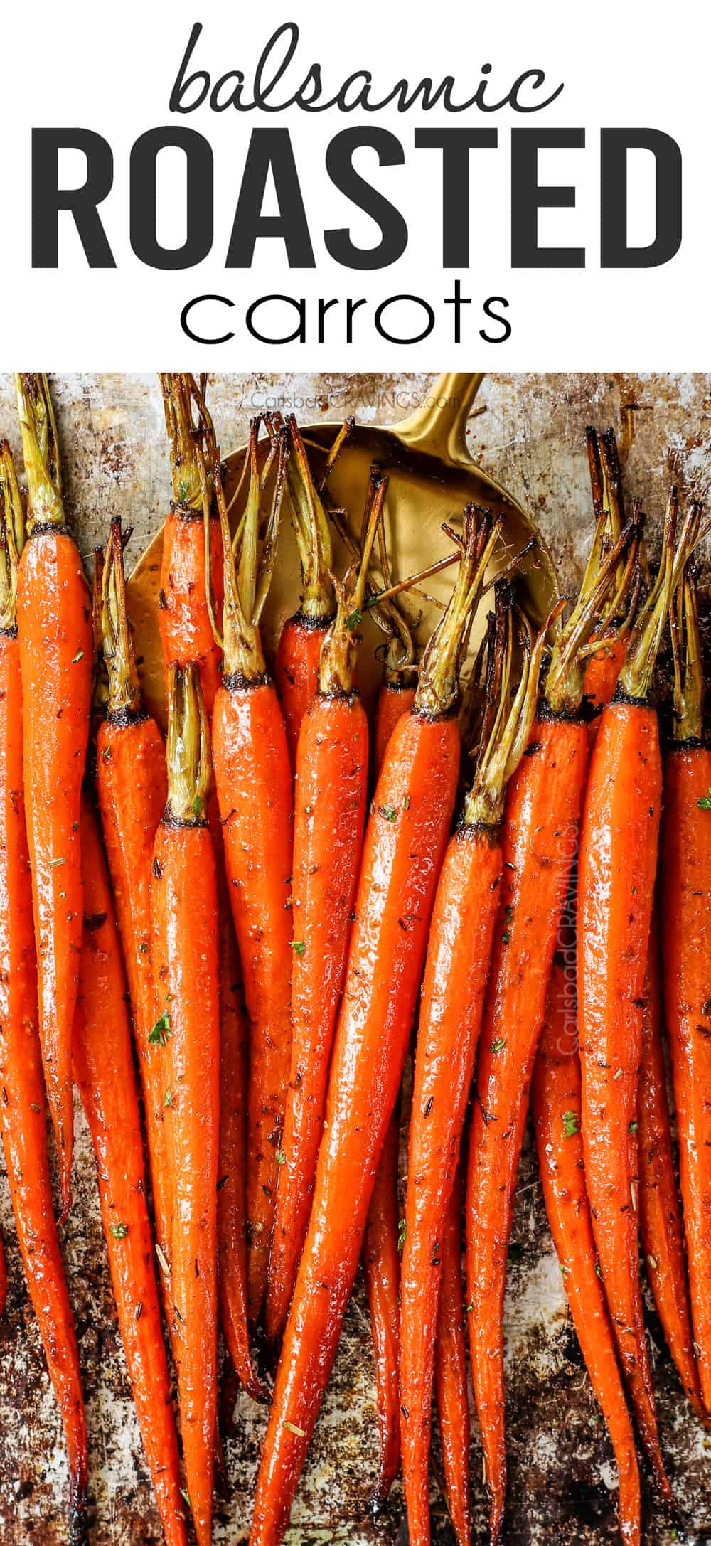 up close of roasted carrots on a baking sheet garnished by parsley