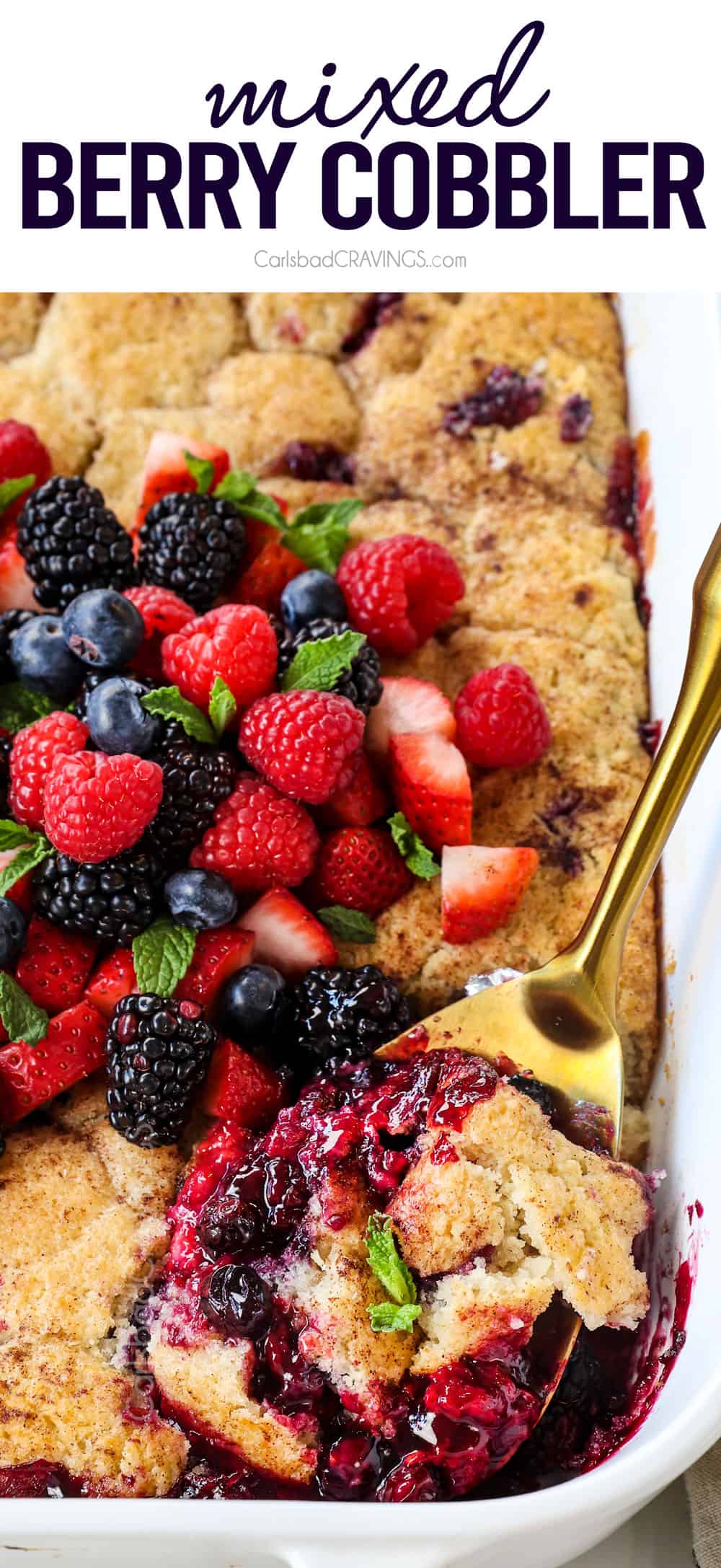 scooping up mixed berry cobbler showing how juicy the filling is