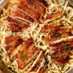 top view of chicken fettuccine alfredo with crispy panko chicken