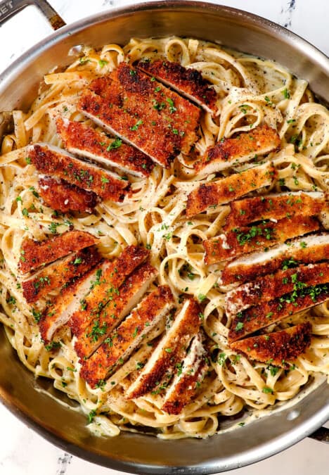 top view of chicken fettuccine alfredo with crispy panko chicken