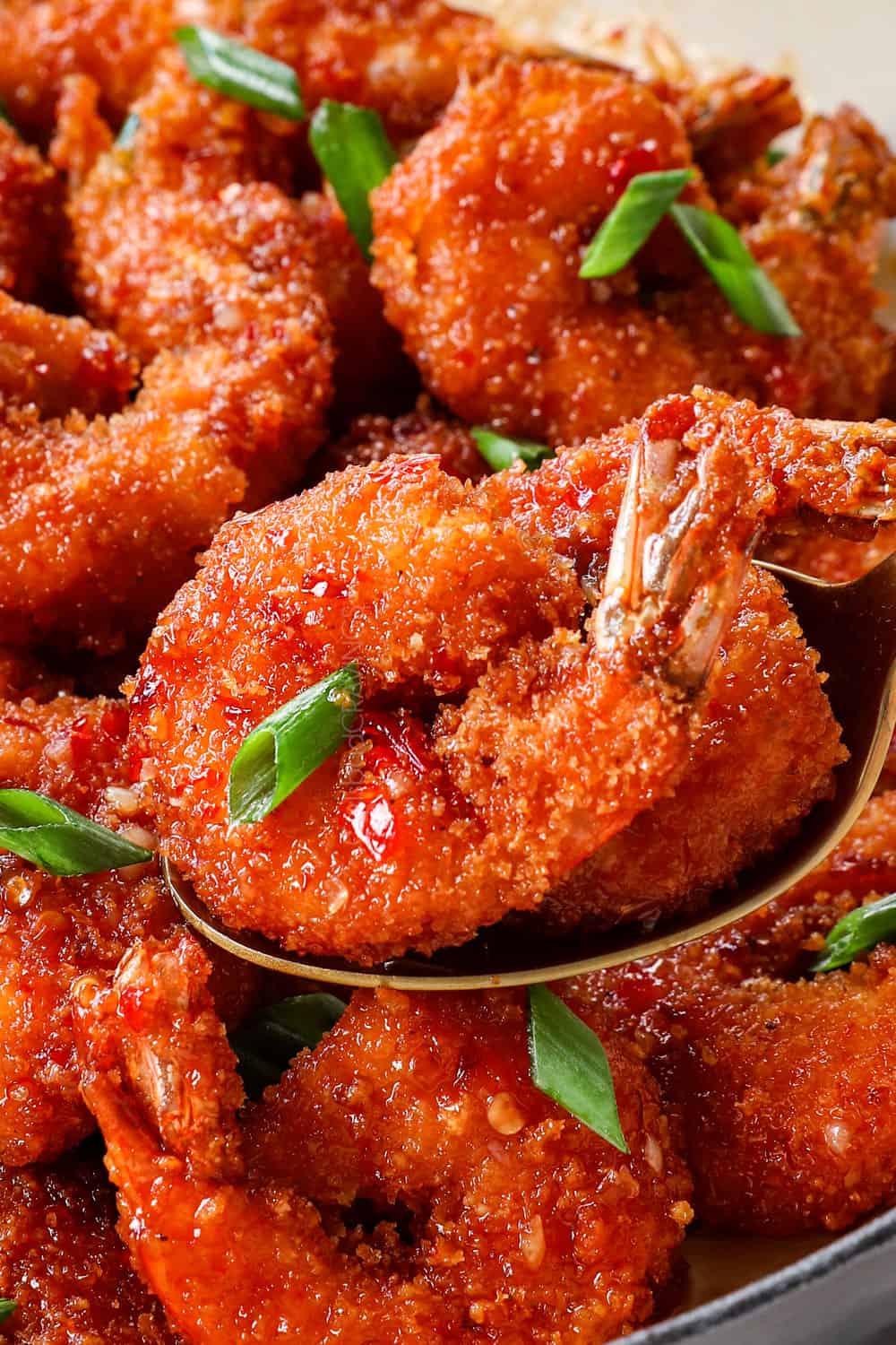 up close of firecracker shrimp in a skillet showing how crispy it is