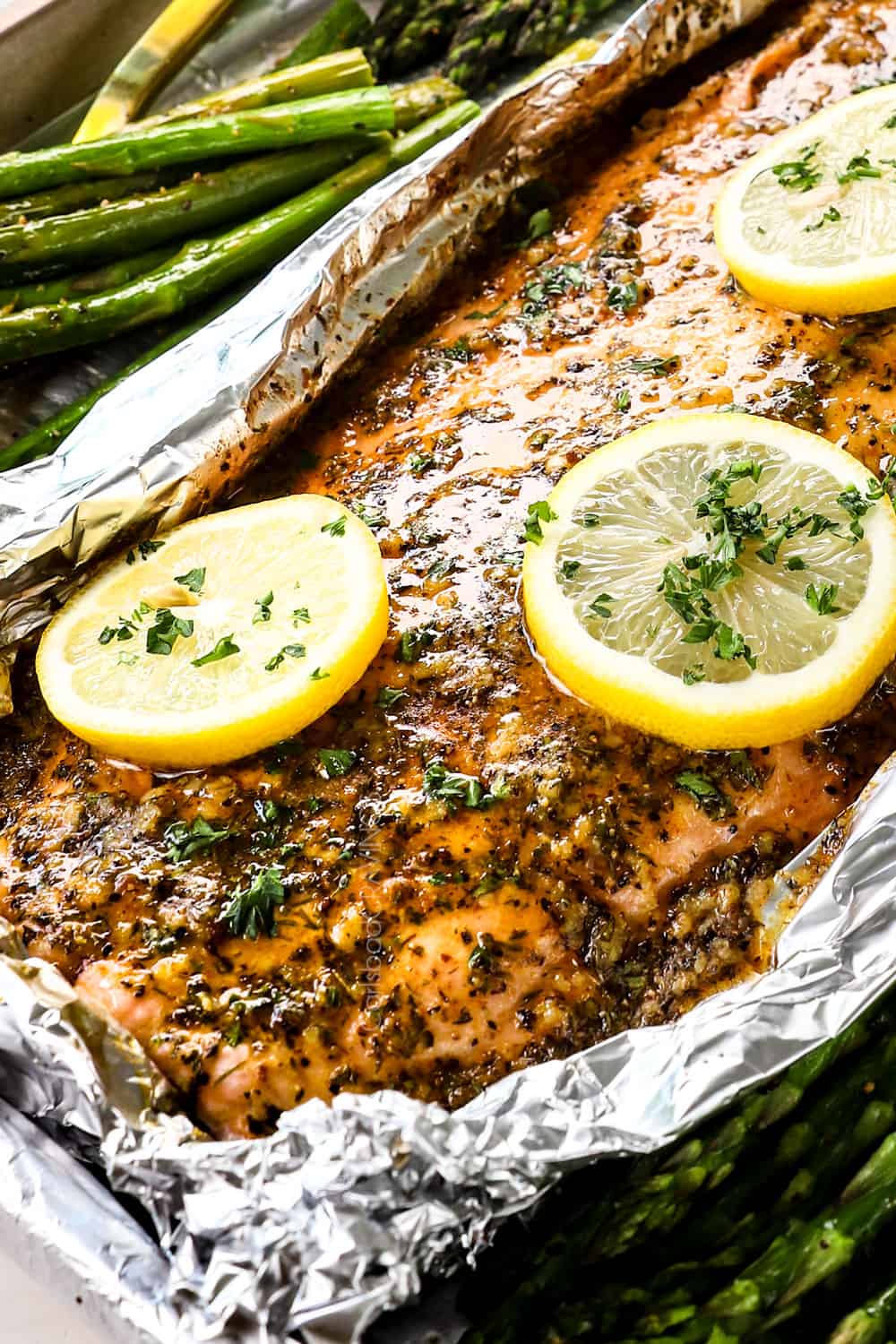 up close of baked lemon pepper salmon recipe with garlic lemon pepper butter