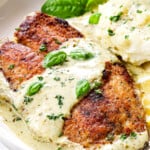 up close of serving tilapia recipe garnished by lemon