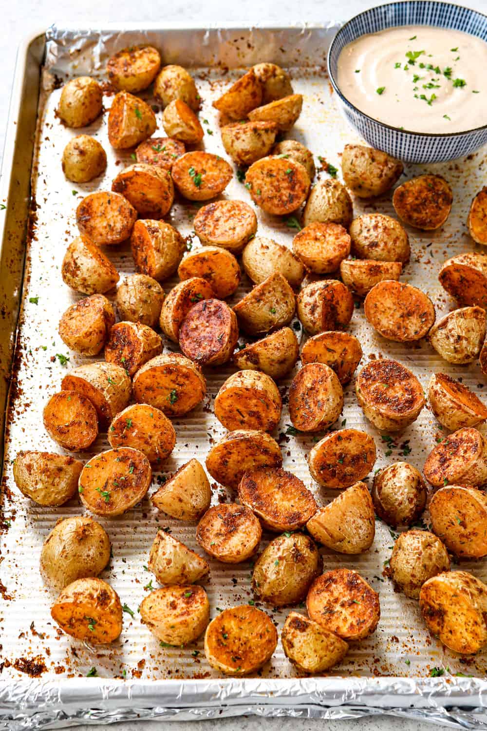 Cajun potatoes roasted in a baking sheet until crispy