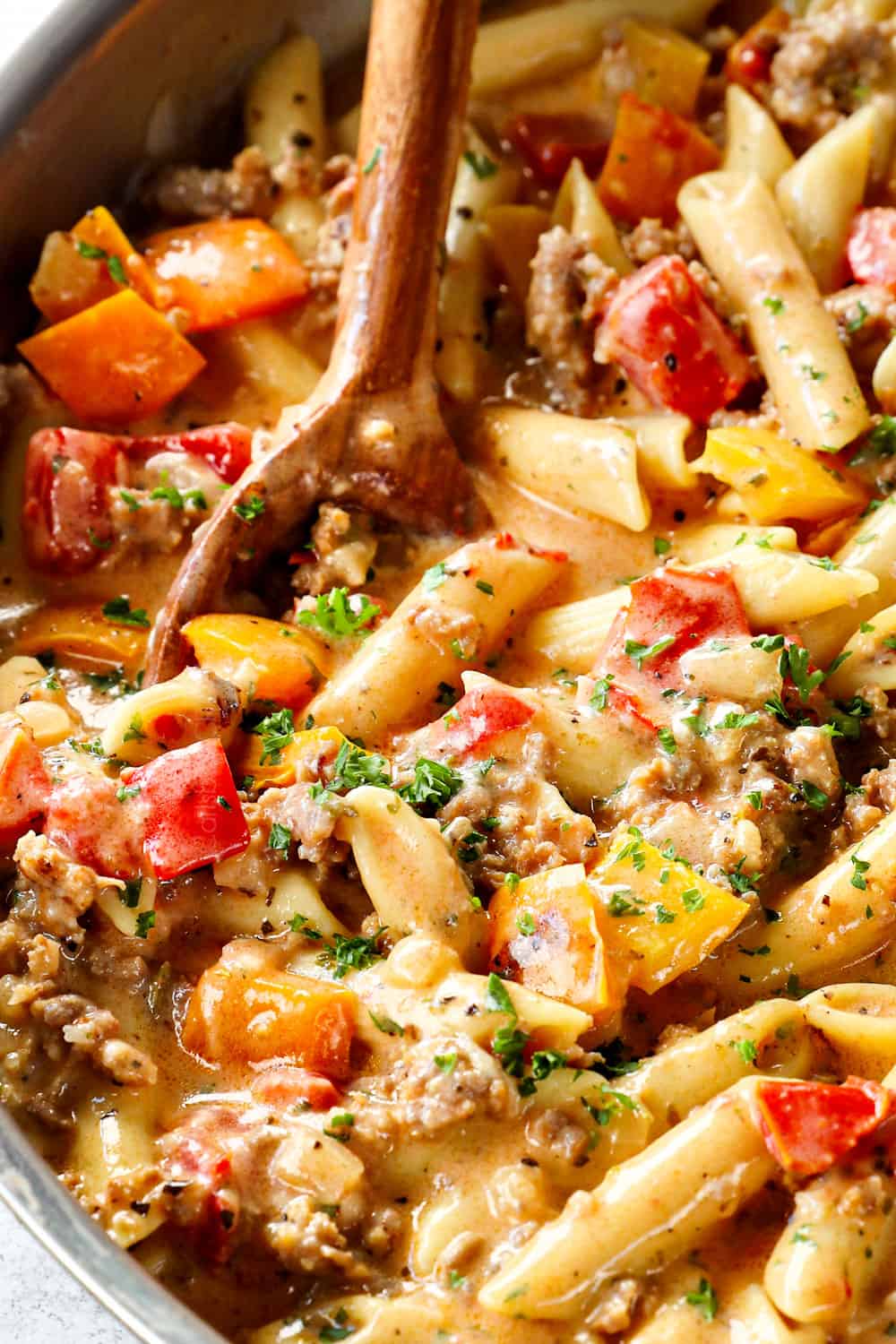 serving sausage pasta with Italian sausage showing how creamy it is