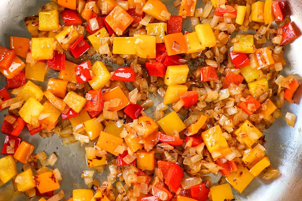showing how to make Sausage Peppers Pasta recipe by sautéing bell peppers until crisp tender