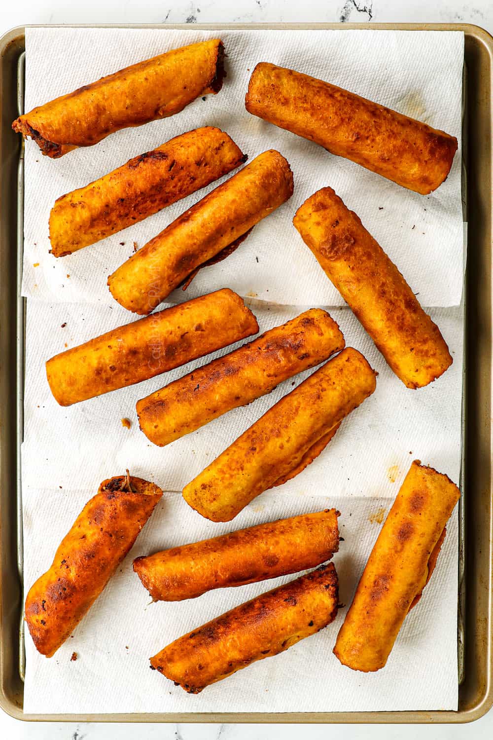 how to make taquitos by transferring to paper towels after frying to cool