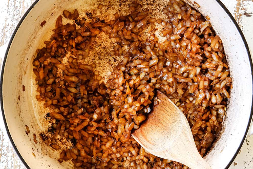 showing how to make adobo sauce by sauteing onions and garlic in a Dutch oven