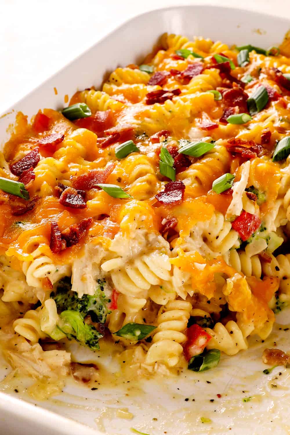 side view of chicken bacon ranch casserole with servings removed from the dish showing how creamy it is