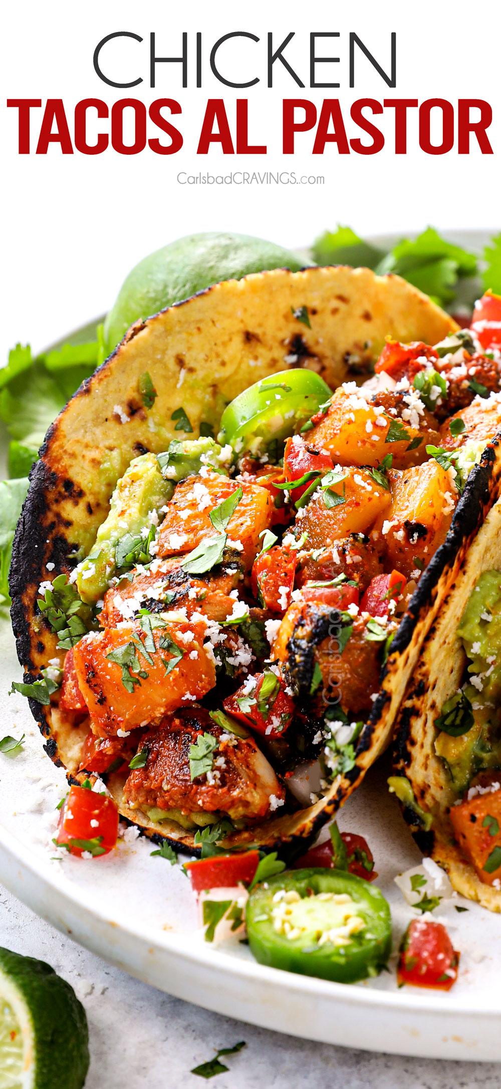 showing how to serve chicken al pastor by adding to corn tortillas to make tacos