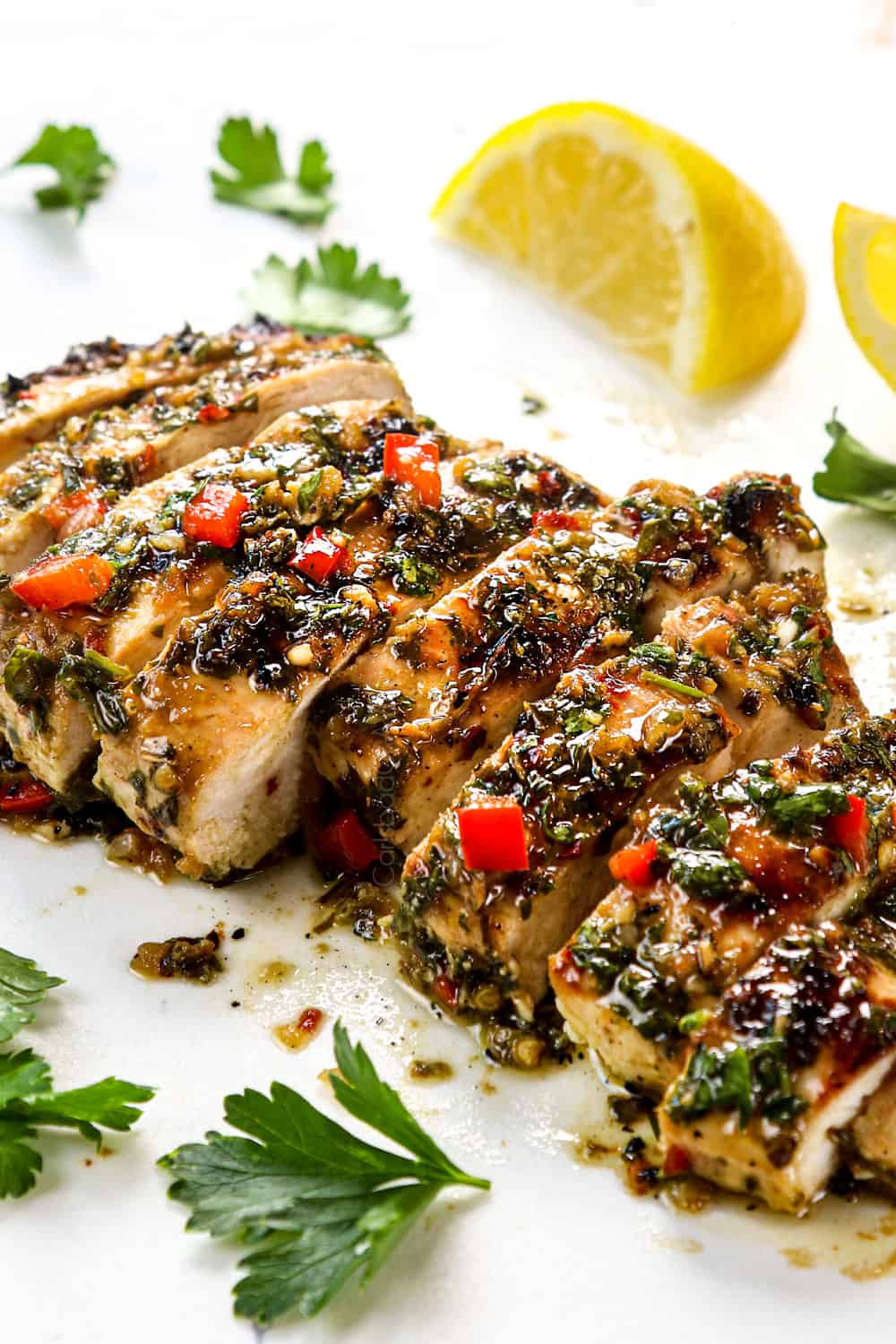 up close of sliced chicken chimichurri showing how juicy it is