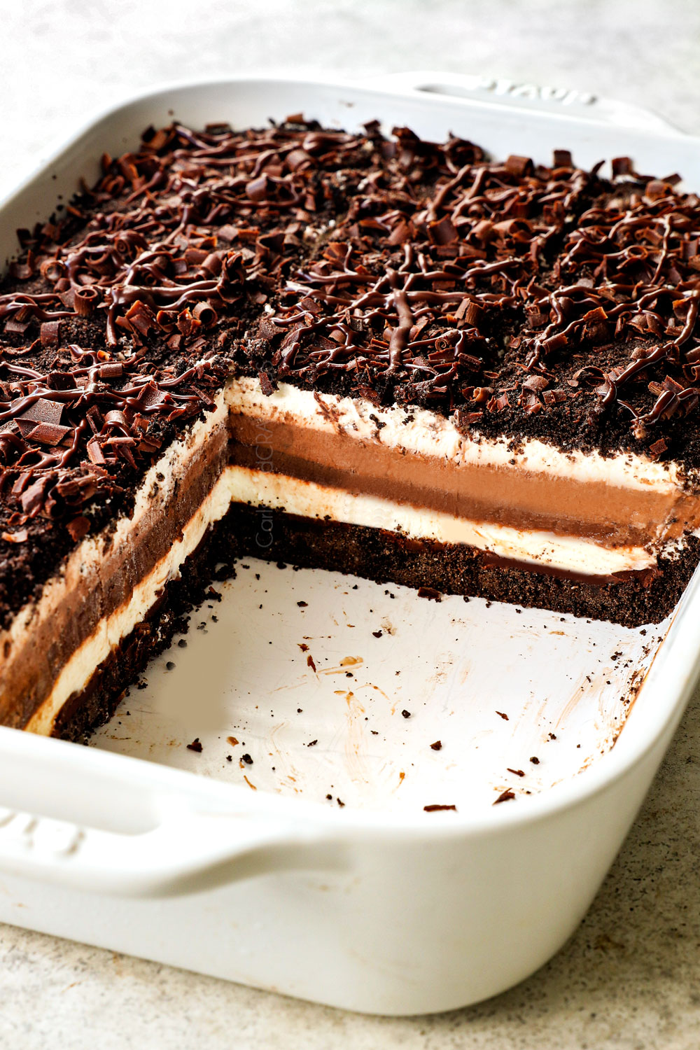 slices removed from chocolate lasagna in 9x13 pan showing the clean layers