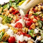 up close of pouring homemade ranch dressing recipe showing how creamy it is
