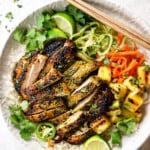 top view Thai chicken sliced and served over rice with pickled vegetables