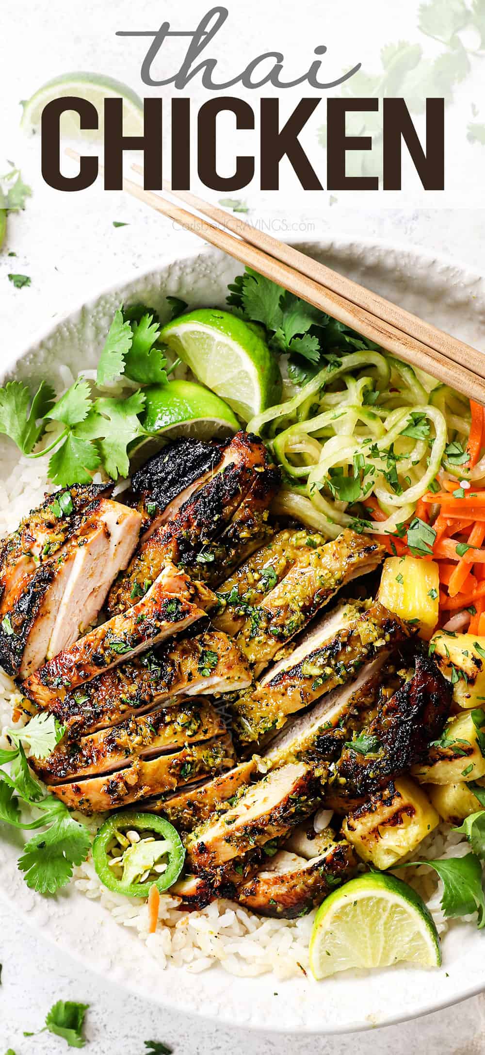 top view showing what to serve with Thai chicken with rice, pickled vegetables and grilled pineapple