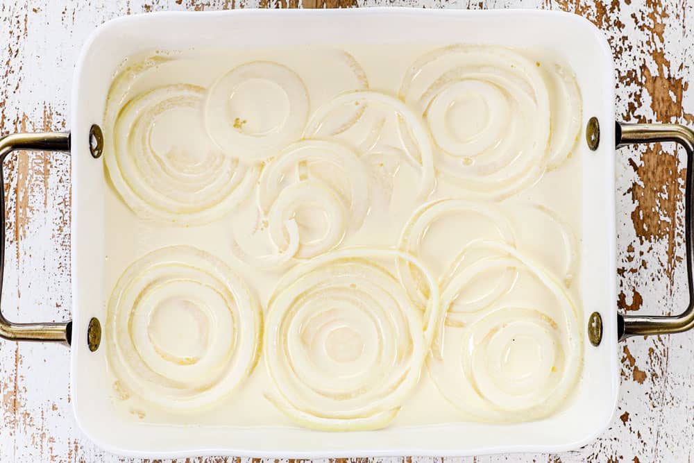 showing how to make BBQ pulled pork sandwiches by soaking onion rings in buttermilk for fried onion rings