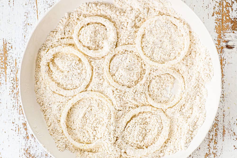 showing how to make BBQ pulled pork sandwiches by breading onion rings in panko flour mixture