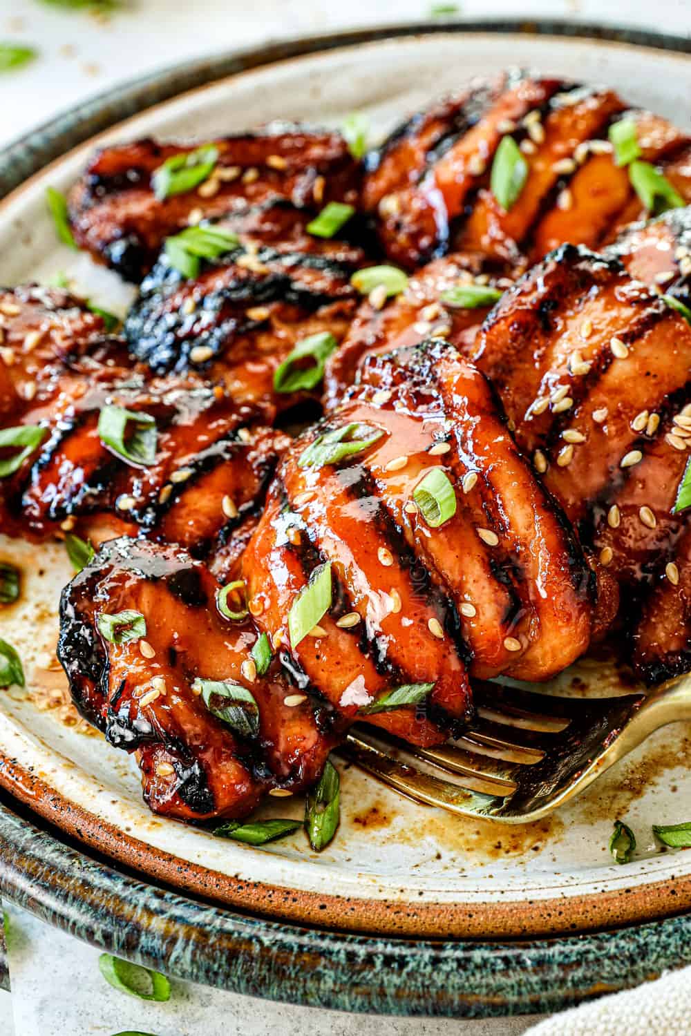 serving marinated grilled chicken thighs