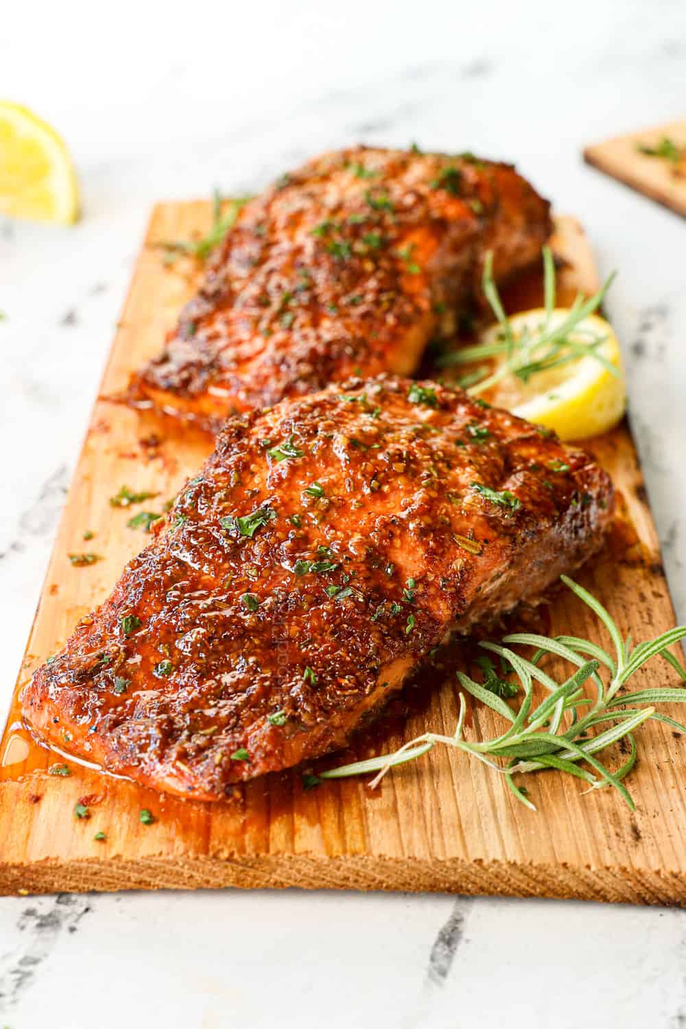 up close of salmon on cedar planks showing how juicy the salmon is