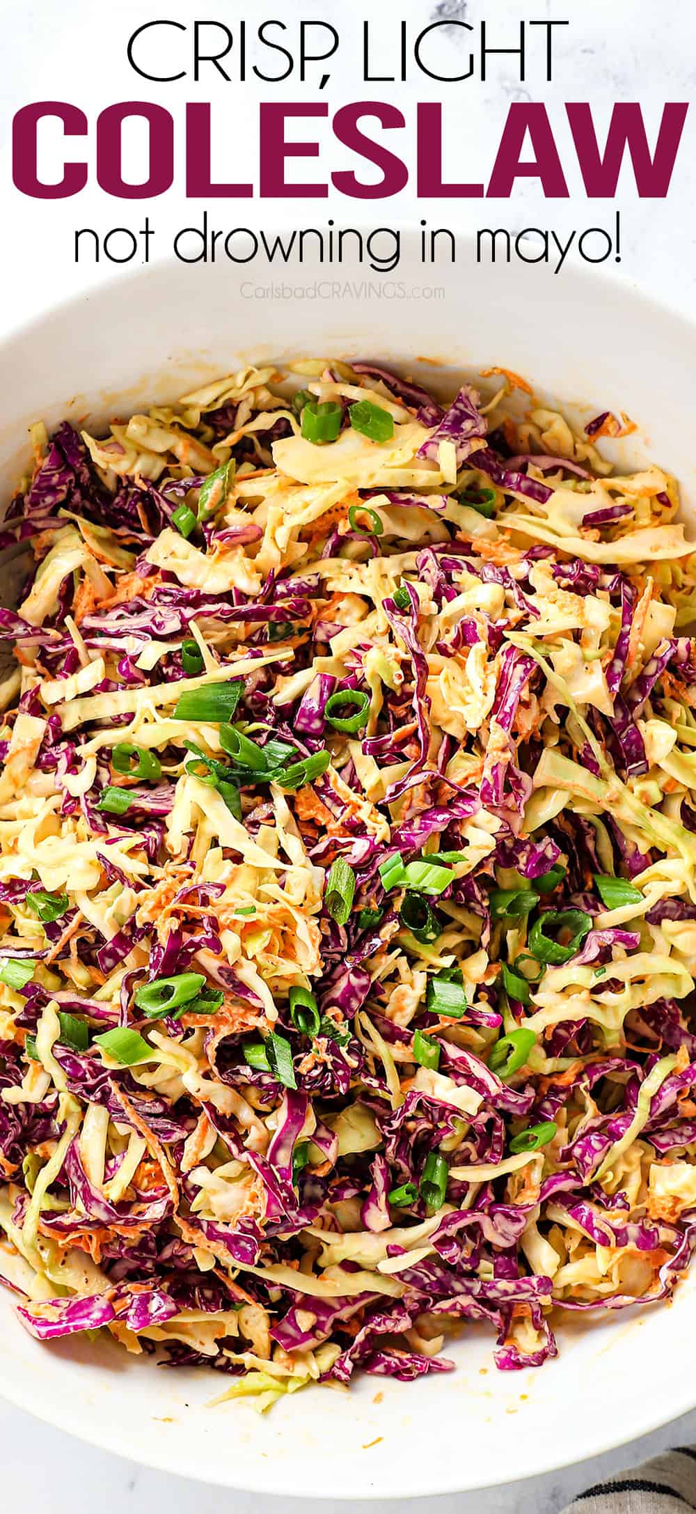 top view of coleslaw recipe by showing coleslaw ingredients of cabbage, carrots and green onions
