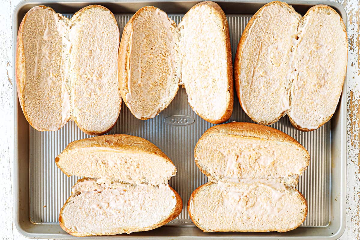 showing how to make Crockpot Philly cheesesteak recipe by toasting the hoagie rolls on a baking sheet