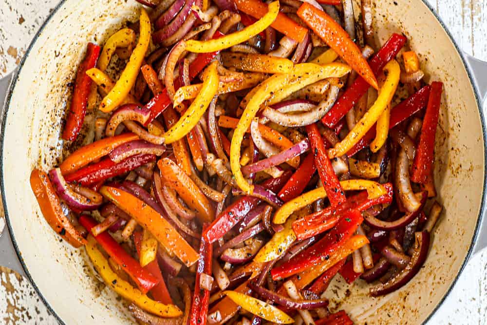 showing how to make jerk chicken pasta (Rasta pasta) by sautéing bell peppers, onions and garlic