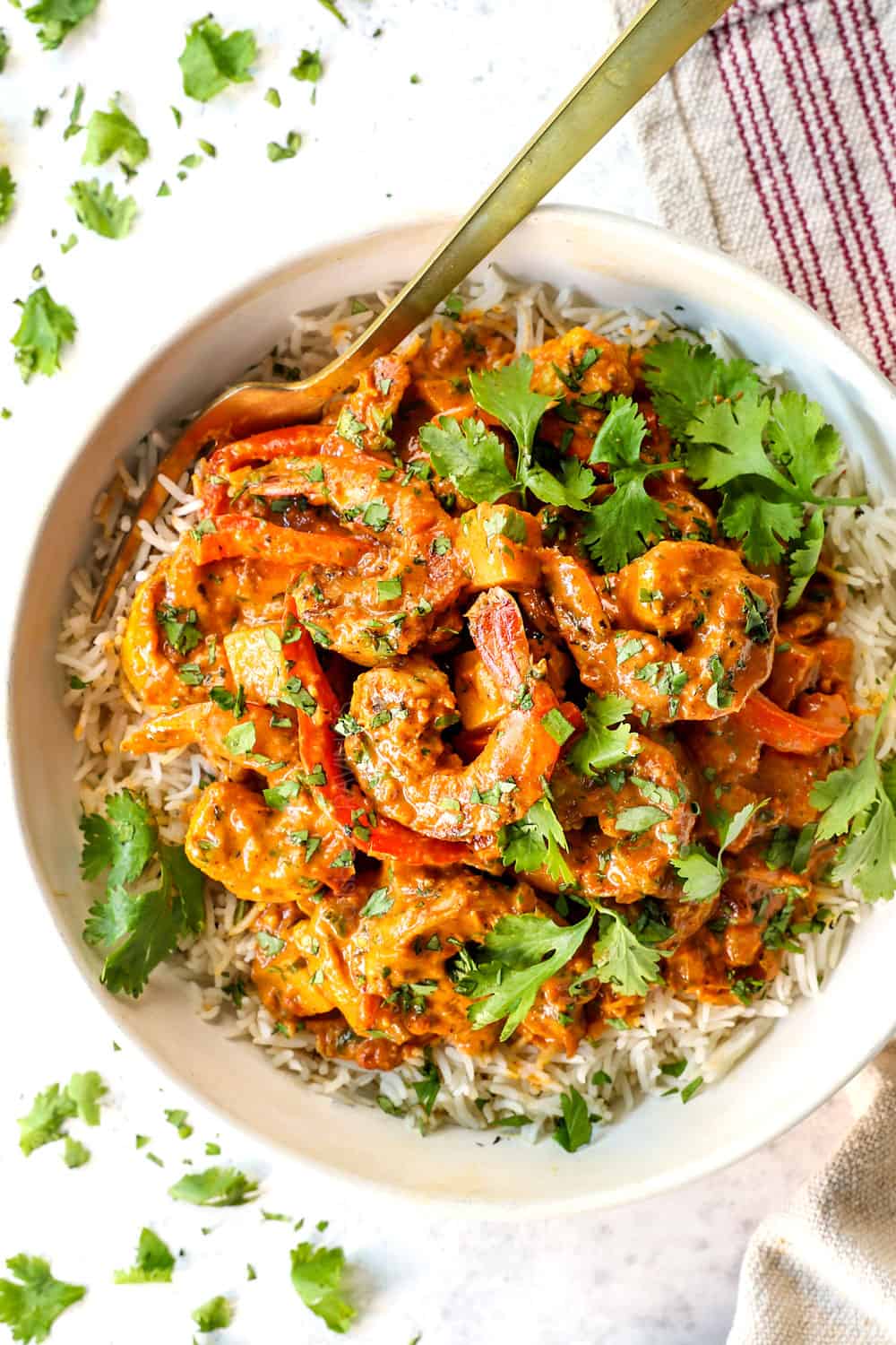 top view of serving Coconut Shrimp Curry in a bowl with rice