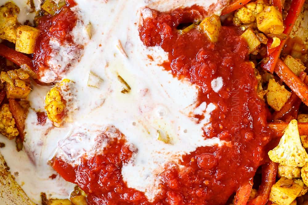 showing how to make coconut shrimp curry recipe by adding coconut milk and crushed tomatoes