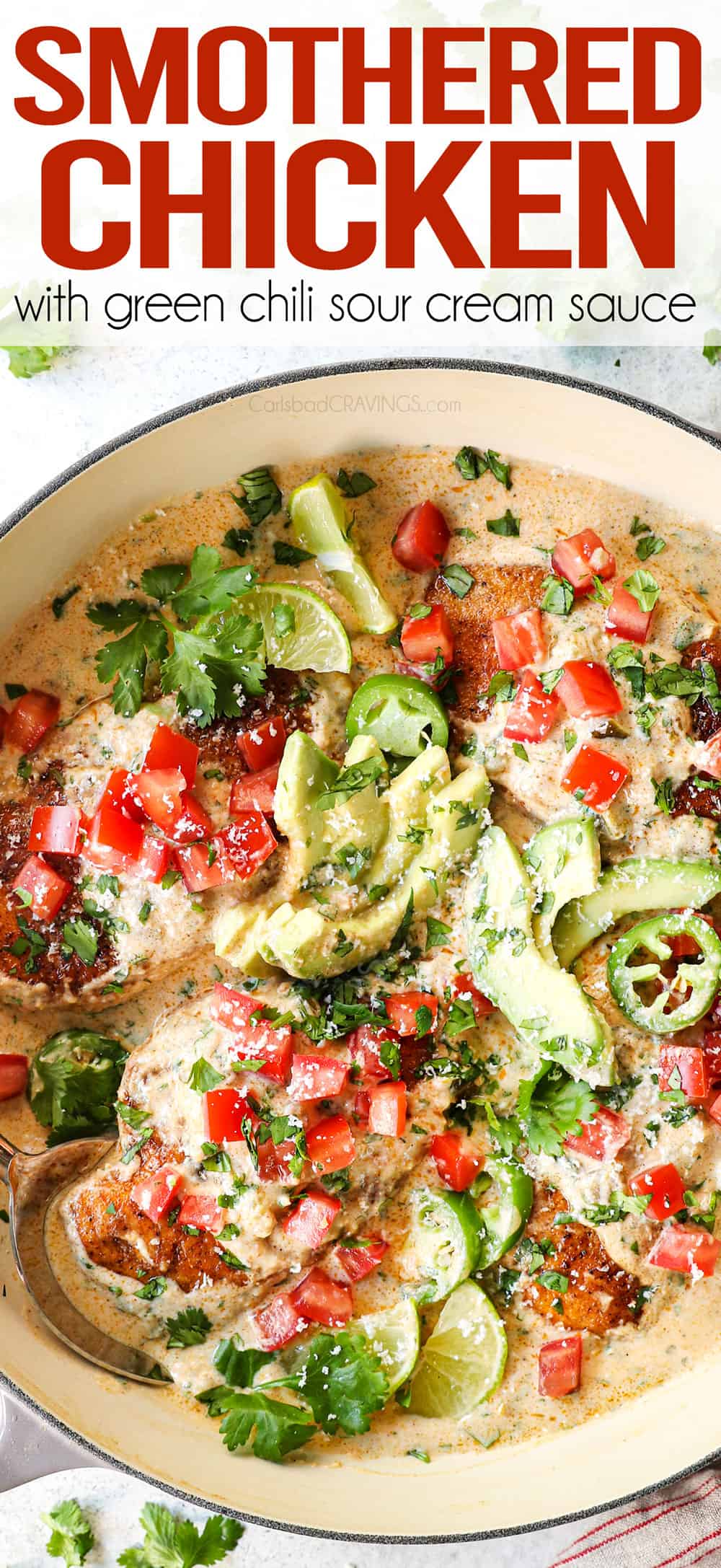 top view of smothered chicken recipe garnished with tomatoes