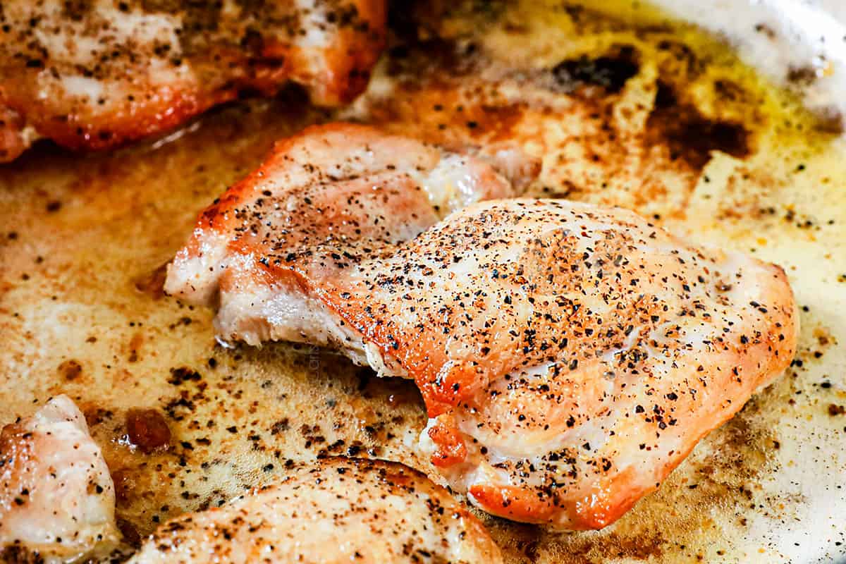 showing how to make chicken taco soup recipe by searing the chicken until golden in a Dutch oven soup pot