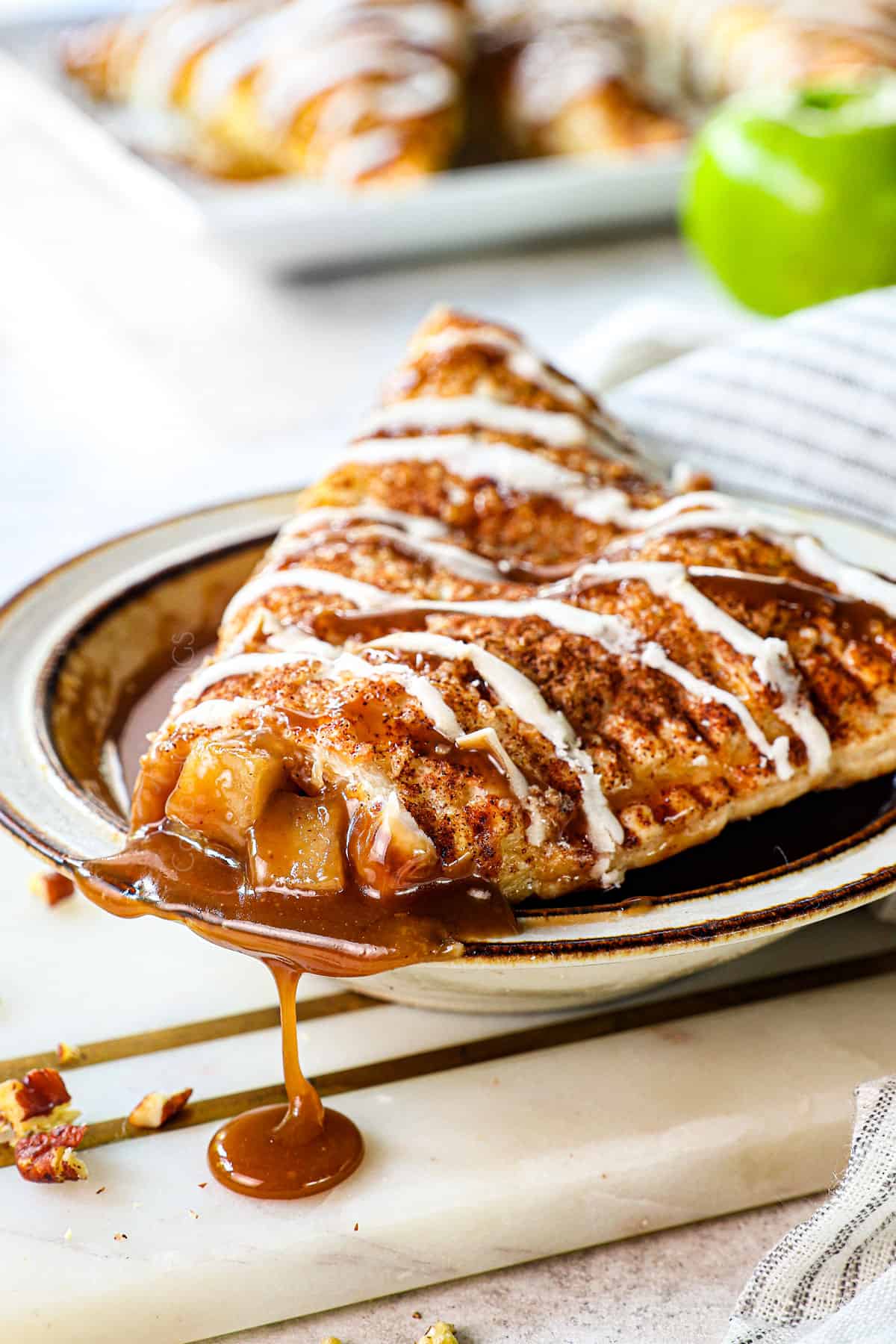 easy apple turnovers with a bite taken out showing the apple filling